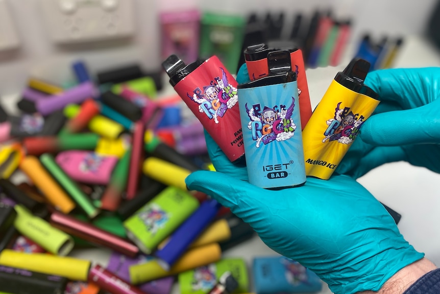 colourful vapes in a pile