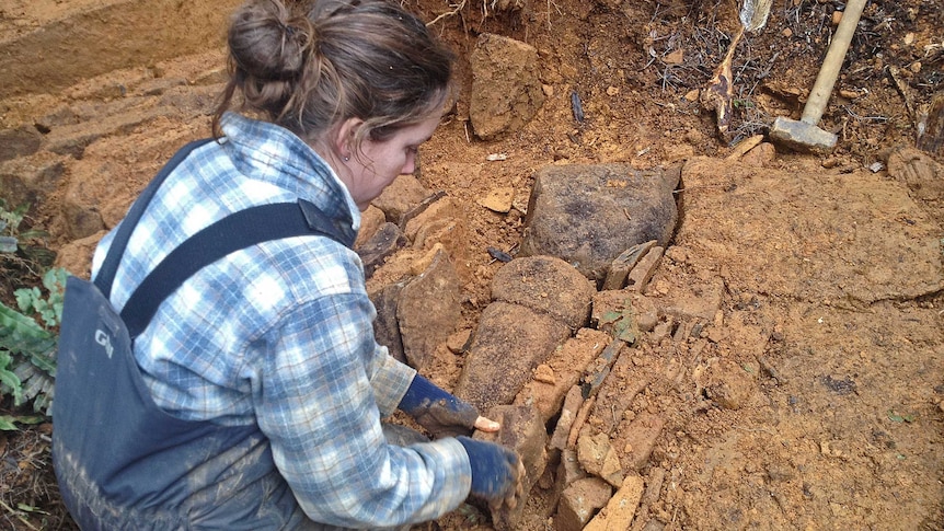 Site manager Beth Campbell works on repairing Higgs Track.