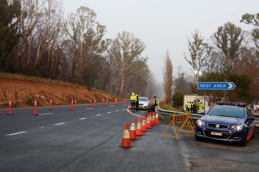 A police checkpoint set up on a country road.