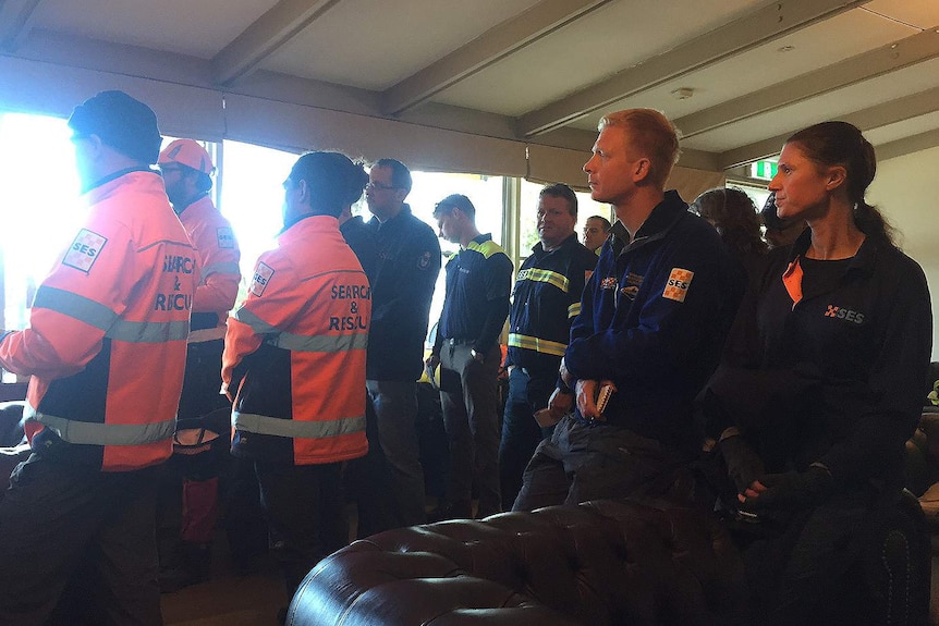 Tasmanian rescue teams listen to briefing on third day of search for John Ward and son Stephen.