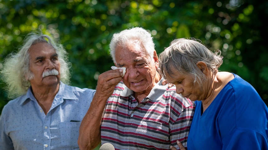 Maurie Japarta Ryan, Hal Hart and Eileen Cummings stand together outside.