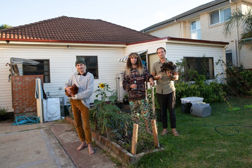 Todd with housemates in garden for feature on young Australians' life during and after coronavirus isolation