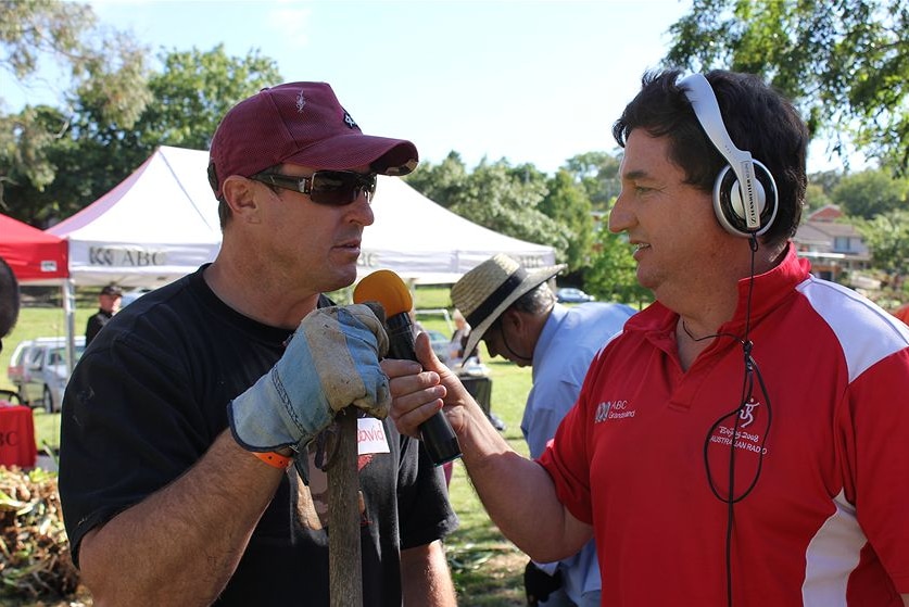 Gavel interviewing Furner with hand held microphone.