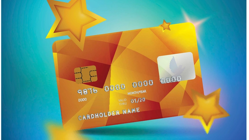 Gold Shiny Plastic Credit Card on Blue Background with Stars