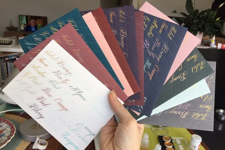 A bunch of colourful paper printed with Lauren's calligraphy writing.