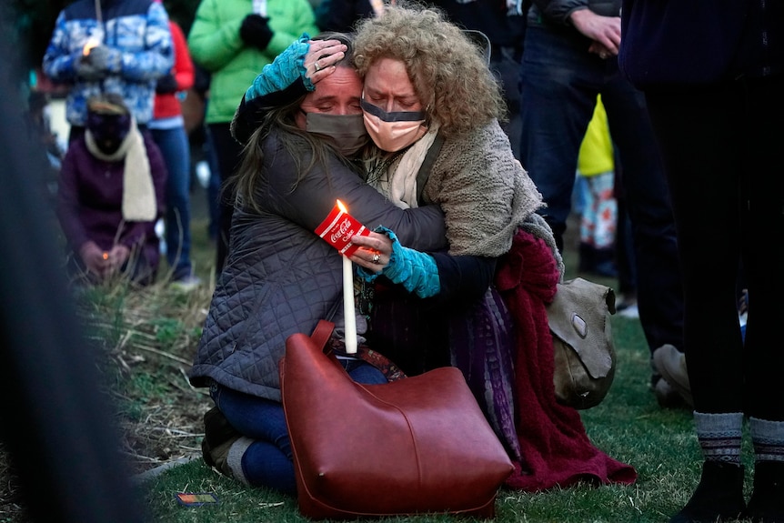 Two women hugging while crying 