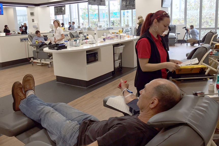 A man gives blood at the Perth Blood Donor Centre.