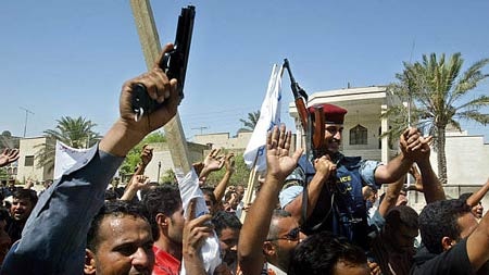 Fallout: Iraqis demonstrate against the British raid in Basra.