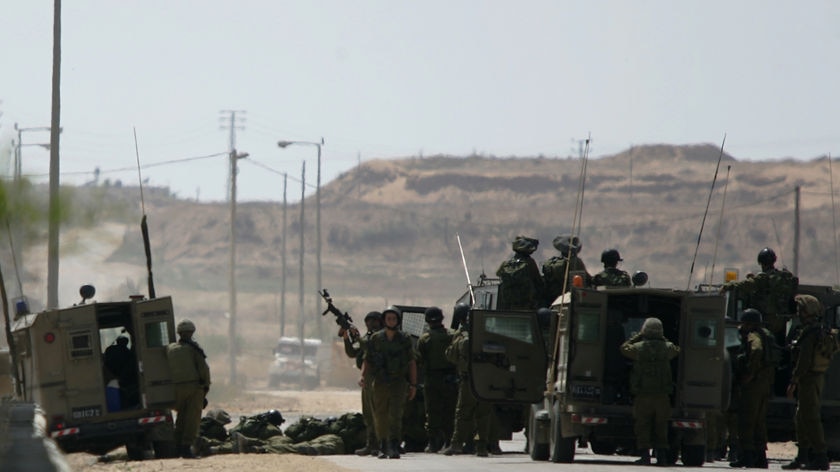 Israel troops battle with Palestinian militants near the Kissufim crossing.