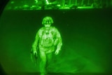 A US soldier seen through a night sight. 