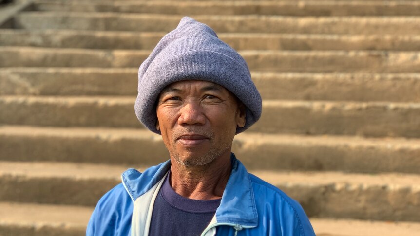 Fisherman Uthai Khampa looks to the camera.