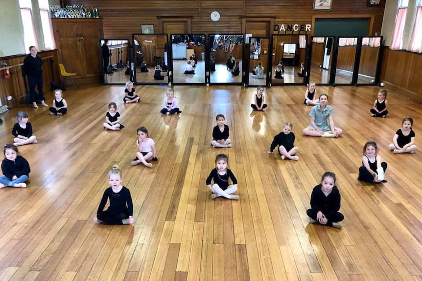 Dance students applying social distancing during a dance class