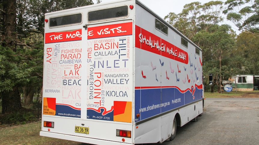 The backend of a truck depicting words of all the locations it travels to