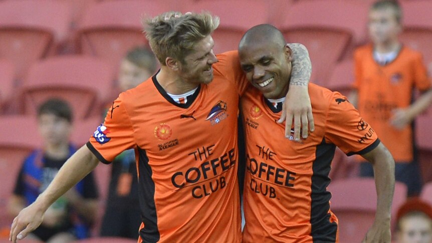 Luke Brattan and Henrique celebrate Brisbane Roar goal