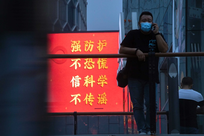 Chinese message in red and yellow reads: "Strengthen Protection, Don't Panic, Believe in Science, Don't spread rumours"