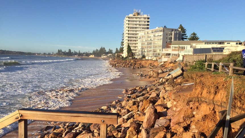 An easterly view of Collaroy beach with houses and apartment blocks which were partially washed away.