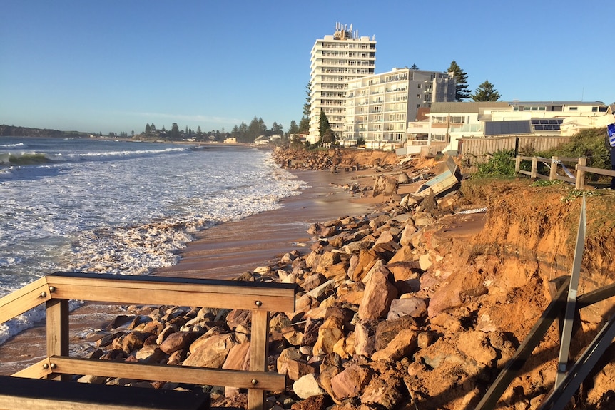 An easterly view of Collaroy beach with houses and apartment blocks which were partially washed away.