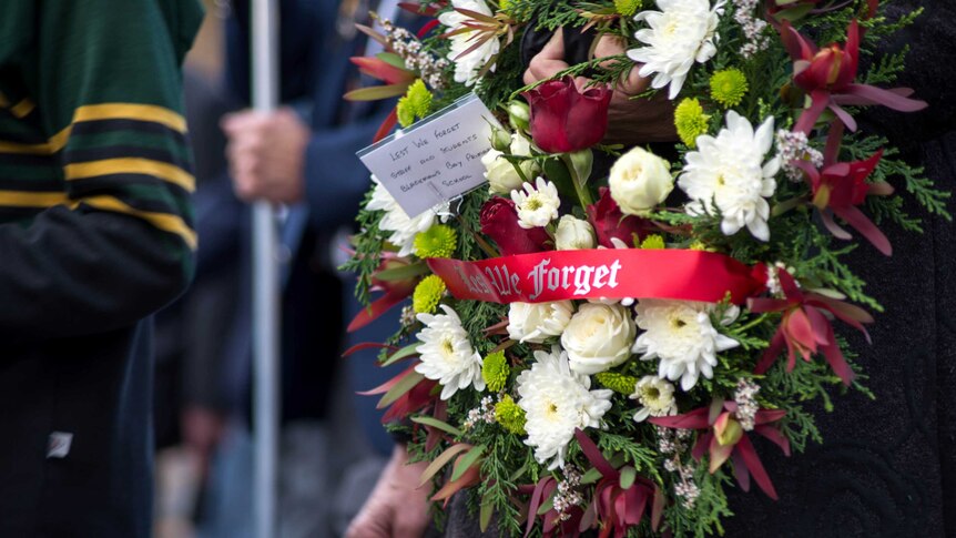 A wreath carried by a marcher on Anzac Day in Hobart 2015