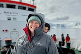 Dr Tamantha Stutchbury stands onboard the vessel as it arrives at Antarctica.