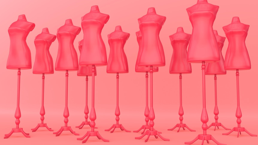 Mannequins standing next to eachother in lines. 