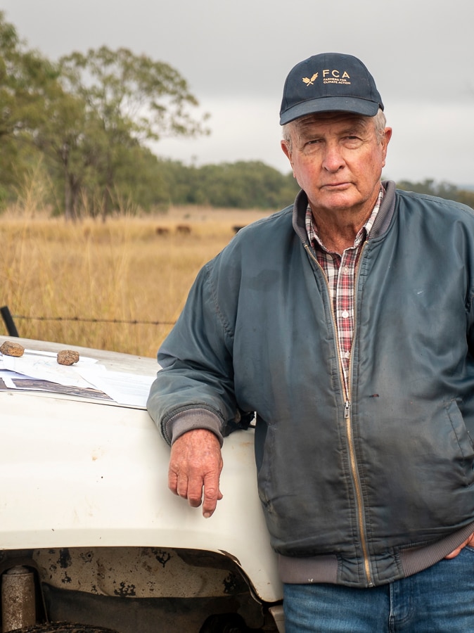 Acland farmer Sid Plant leaning on the bonnet of his farm ute in June 2020.