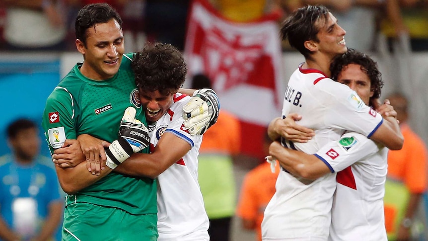 Keylor Navas embraced after win over Greece