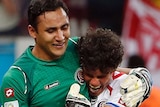 Keylor Navas embraced after win over Greece