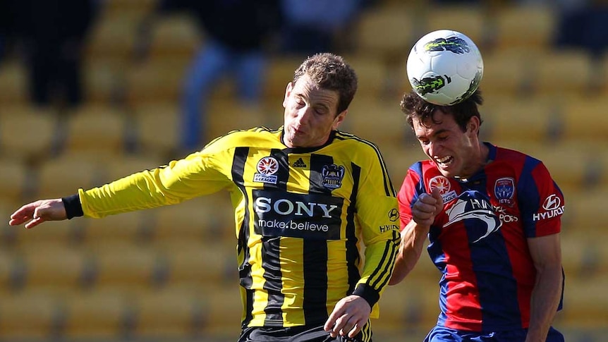 Greenacre and Kantarovski challenge for the ball