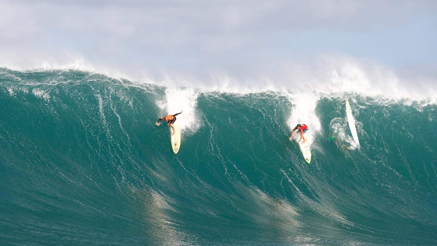 Kelly Slater (left) and fellow competitor Reef McIntosh at a previous Eddie Aikau Big Wave Invitational