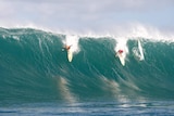 Kelly Slater (left) and fellow competitor Reef McIntosh at a previous Eddie Aikau Big Wave Invitational