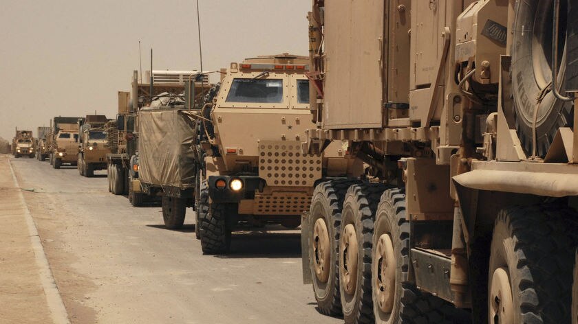 US military vehicles withdraw from a military base near Suwayra, 50 kilometres south-east of Baghdad