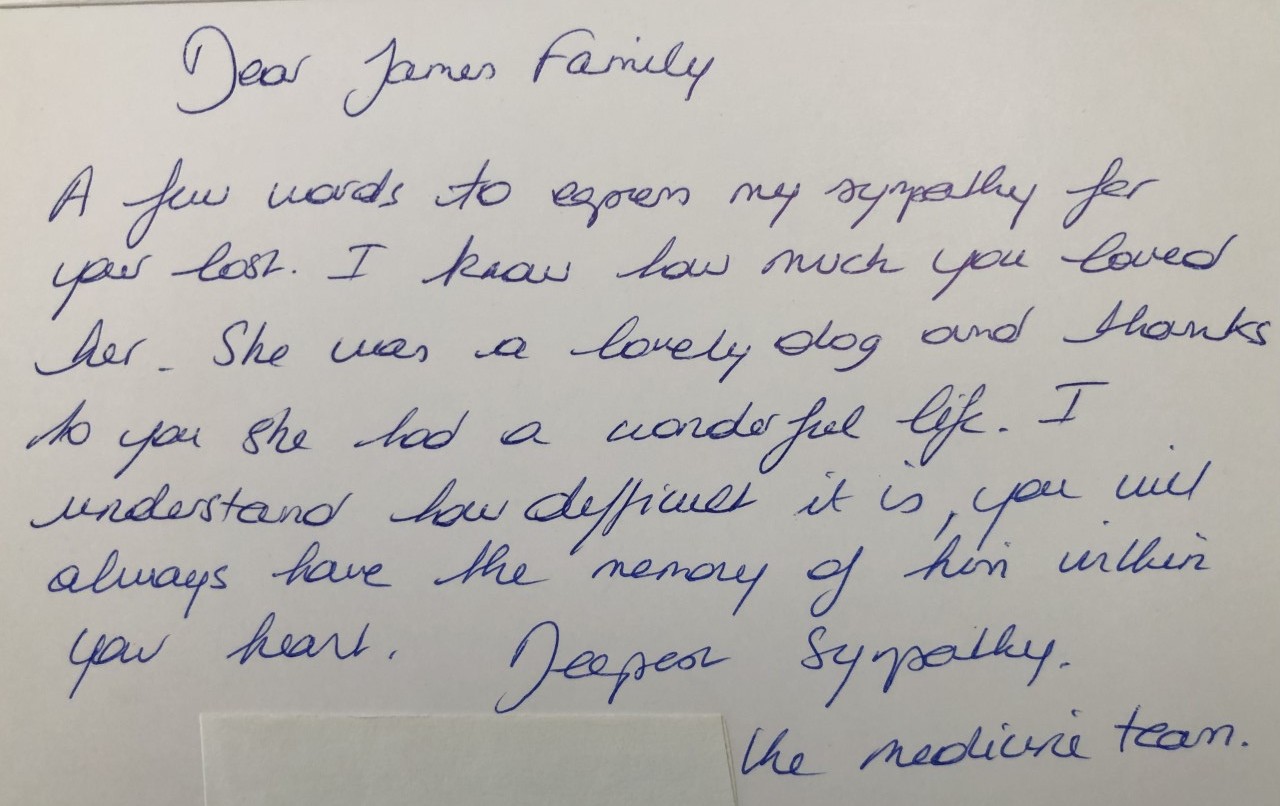 A card  with cursive handwriting sent by U-Vet staff sent Joan James and her family after their dog died.