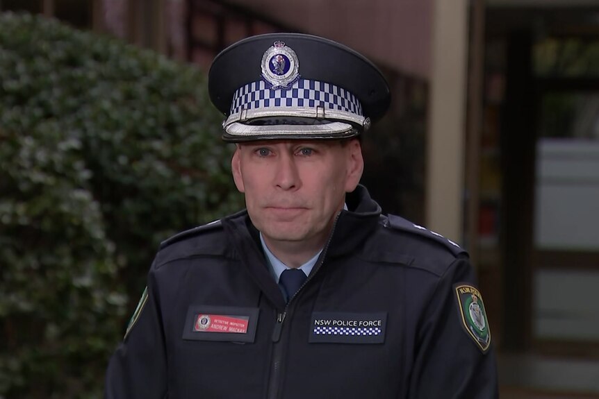 A police officer standing in front of a press release