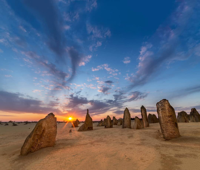 The sunrise over rock mounds.