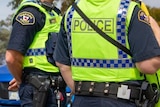 Two Tasmania Police officers at a traffic stop.