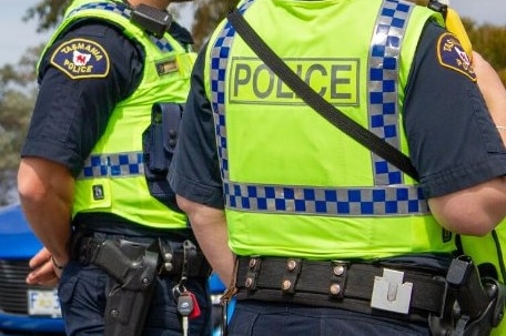 Two Tasmania Police officers at a traffic stop.