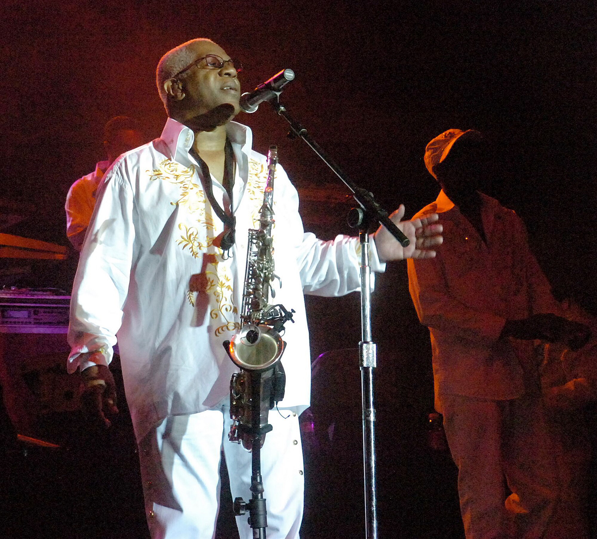 a man looking up while performing on stage