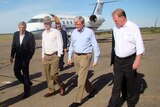 Prime Minister Kevin Rudd, 2nd right, walks from a Royal Flying Doctor Service jet in Broken Hill