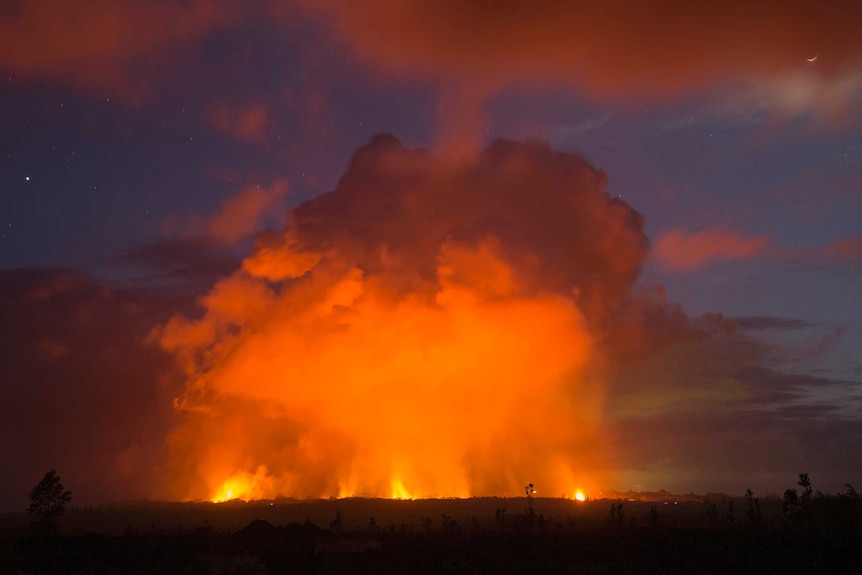 Volcanic activity glows in the distance