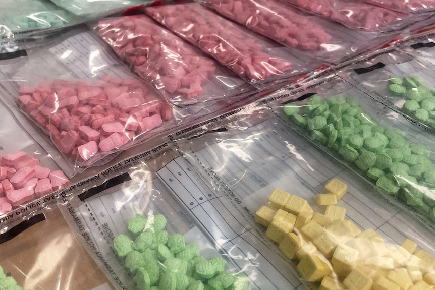 Bags of colourful MDMA pills.