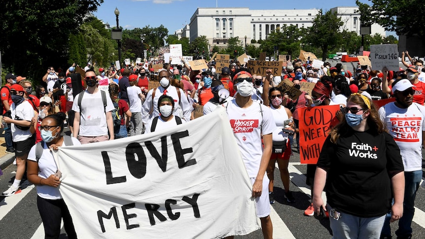 Faith workers in Washington D.C. organized a protest of marching, song and prayer as a Christian response to racial injustice.