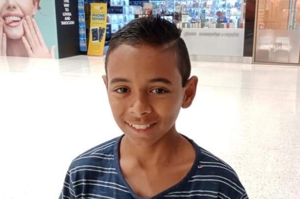 A young boy in a shopping centre