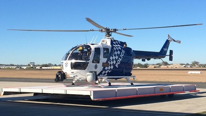 Queensland police helicopter PolAir 2 on the ground at Archerfield Airport in Brisbane