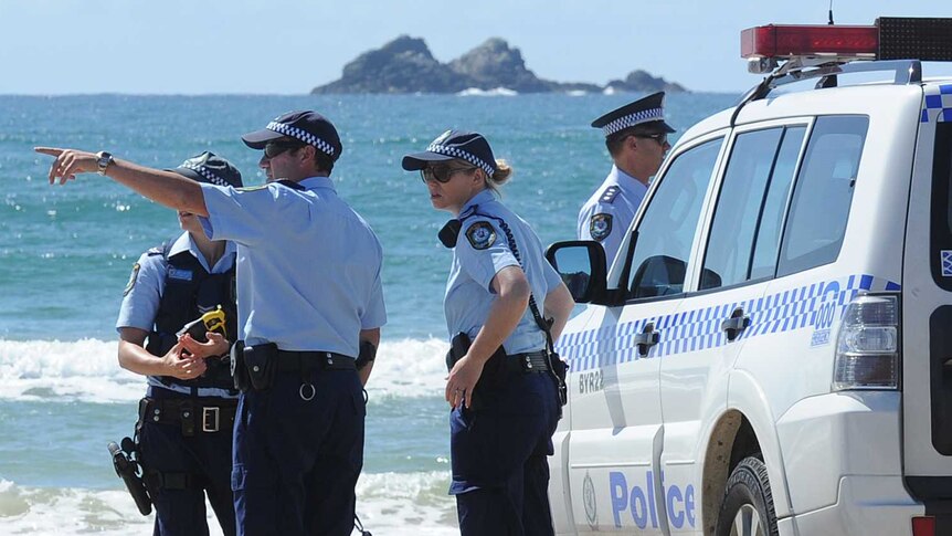 Police officers from the Tweed/Byron district attending a shark attack at Byron Bay in 2014.
