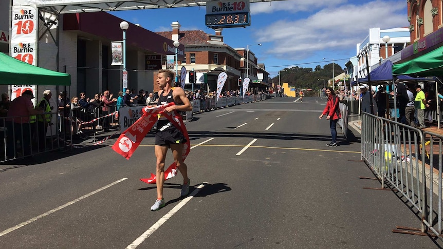 Olympian Brett Robinson crosses Burnie Ten finish line