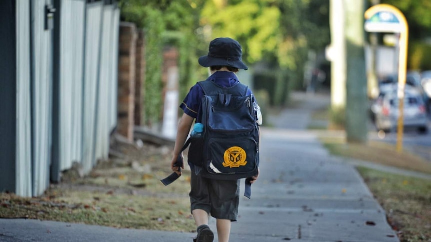 An anonymous primary school child walking to school in Brisbane.