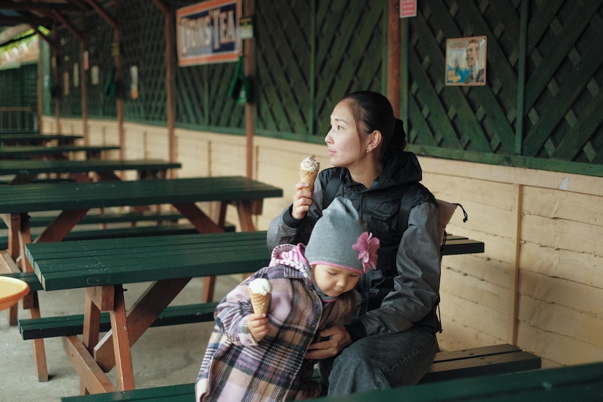 Togzhan Mussirova eats ice cream with her daughter