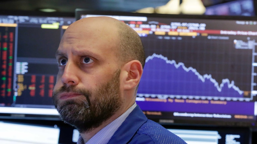 Trader Meric Greenbaum looks concerned as he watches the bloomberg monitors in the new york stock exchange