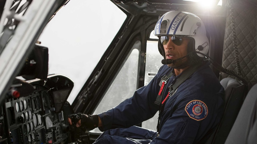 Actor Dwayne Johnson at the controls of CareFlight's rescue helicopter