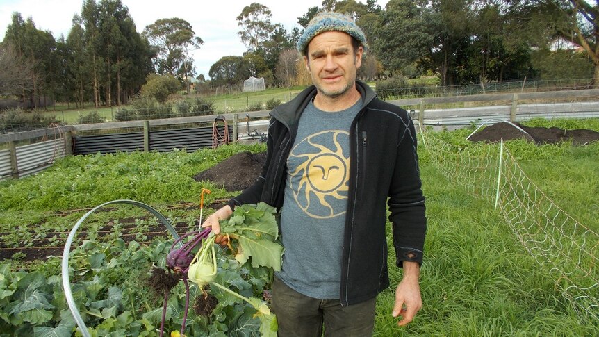 Seed merchant Sam Bayley and some produce grown from seed